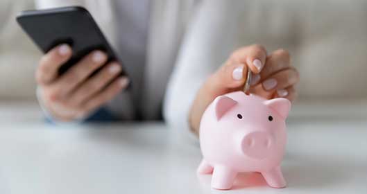 Crop Close Up Of Woman Put Coin In Piggy Bank Save Money For Future